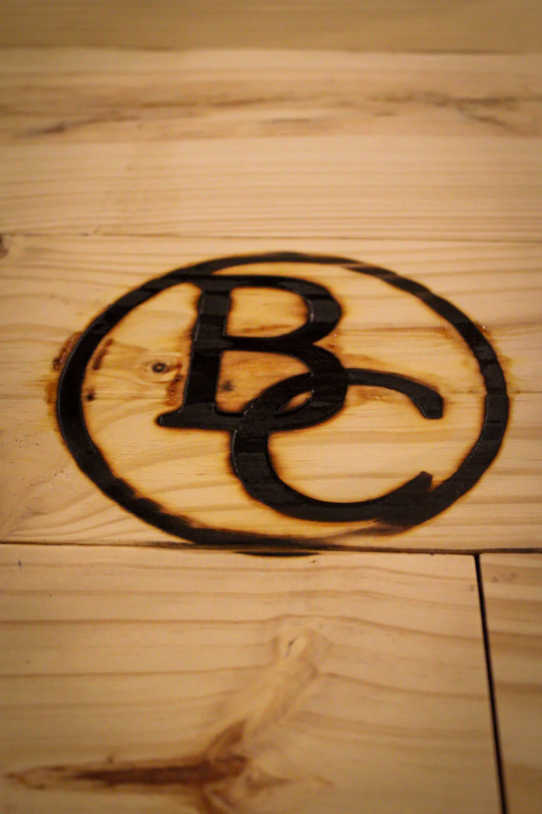 A BC branding iron pressed onto the bar