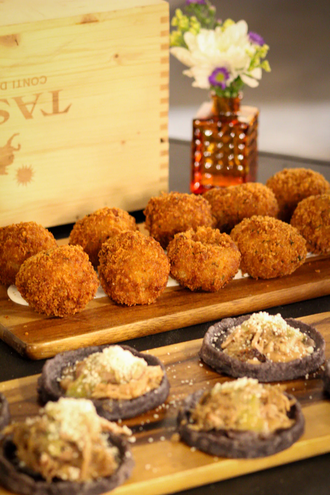 Light bites presented on a wooden serving board