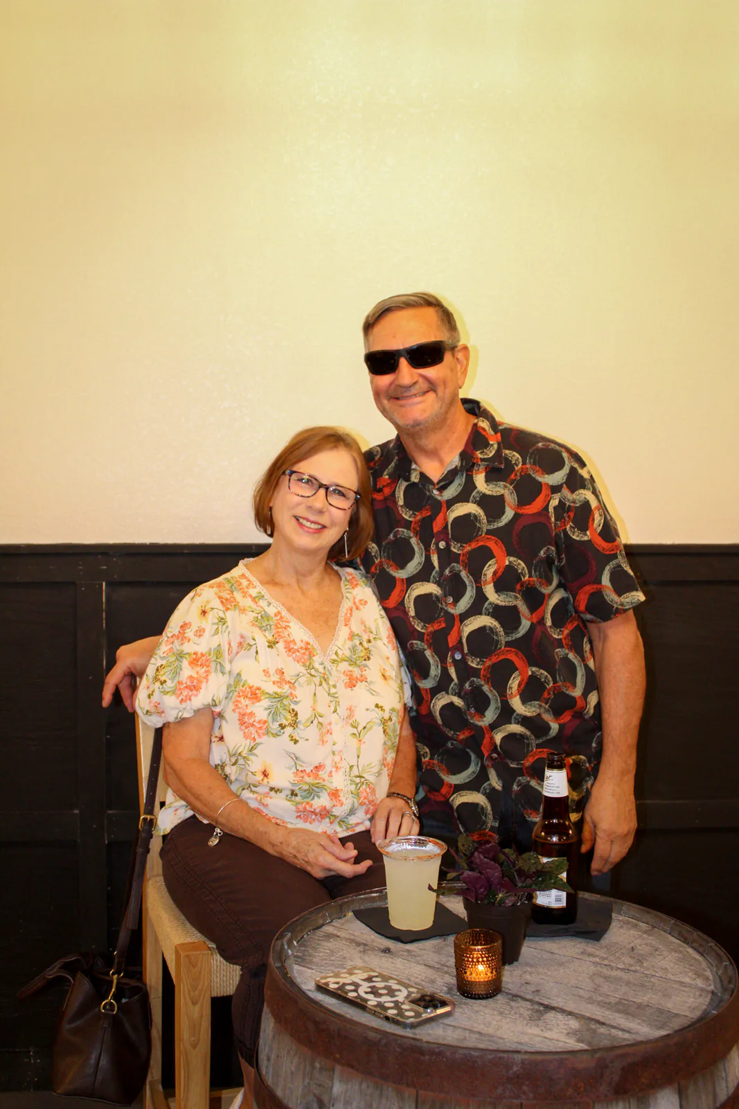 Two guests smiling together at a table during Brand the Bar