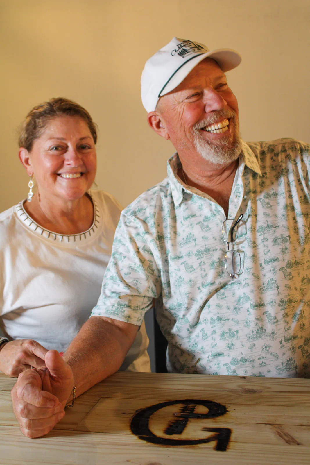 Two guests smiling together inside The Warehouse