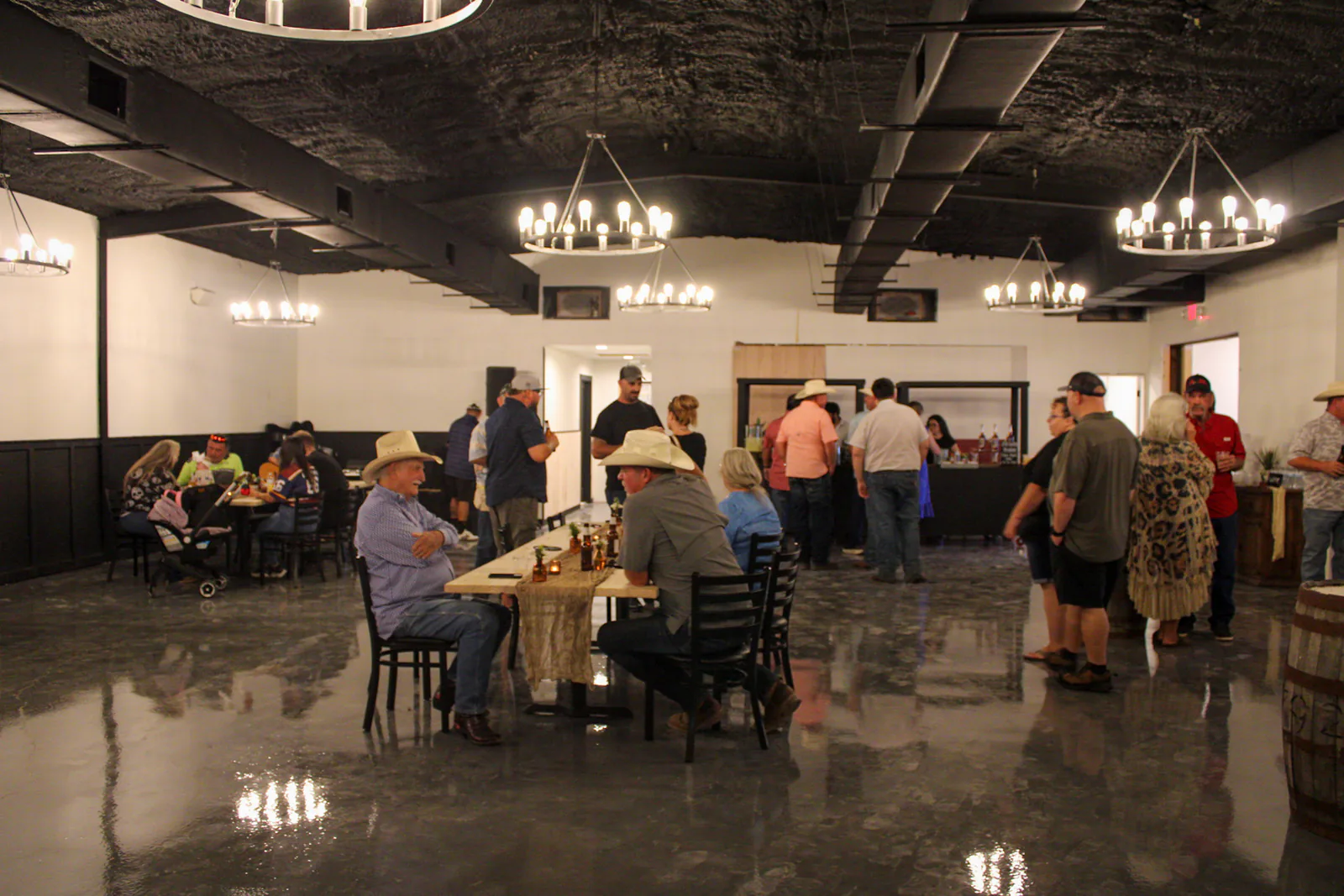 Wide view across the event layout inside The Warehouse